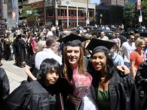 Ashley (right) with her friends at graduation.